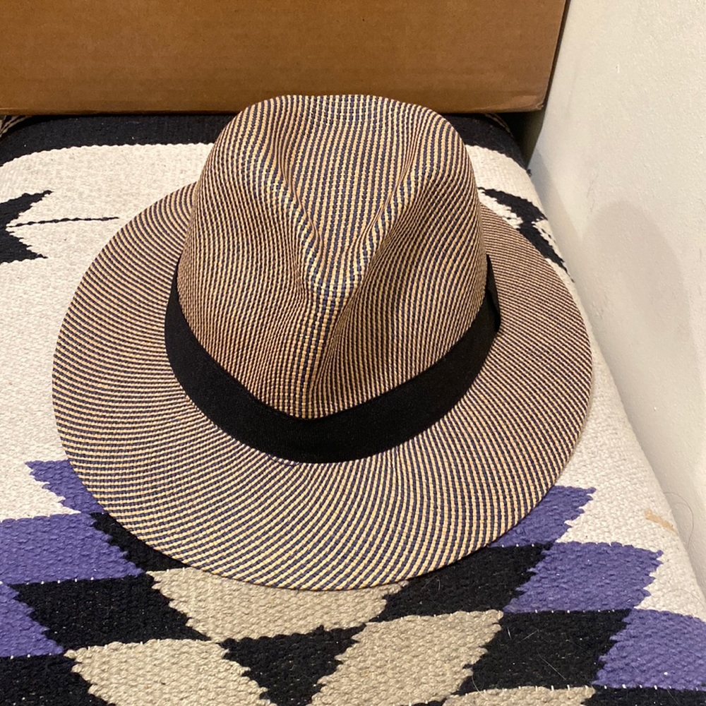sun hat, black ribbon band, slightly dented